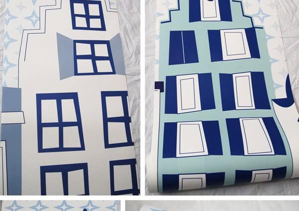 Behang, kinderbehang met blauwe huizen en sterren.