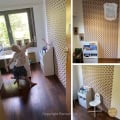 Kinderbehang in kinderkamer met speelse patronen.